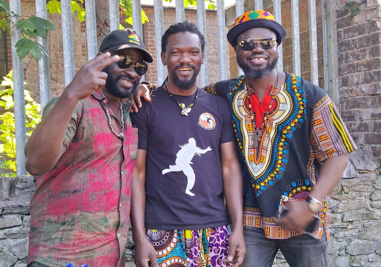 Global Roots Brothers: Nathan Harllels with bandmates outdoors